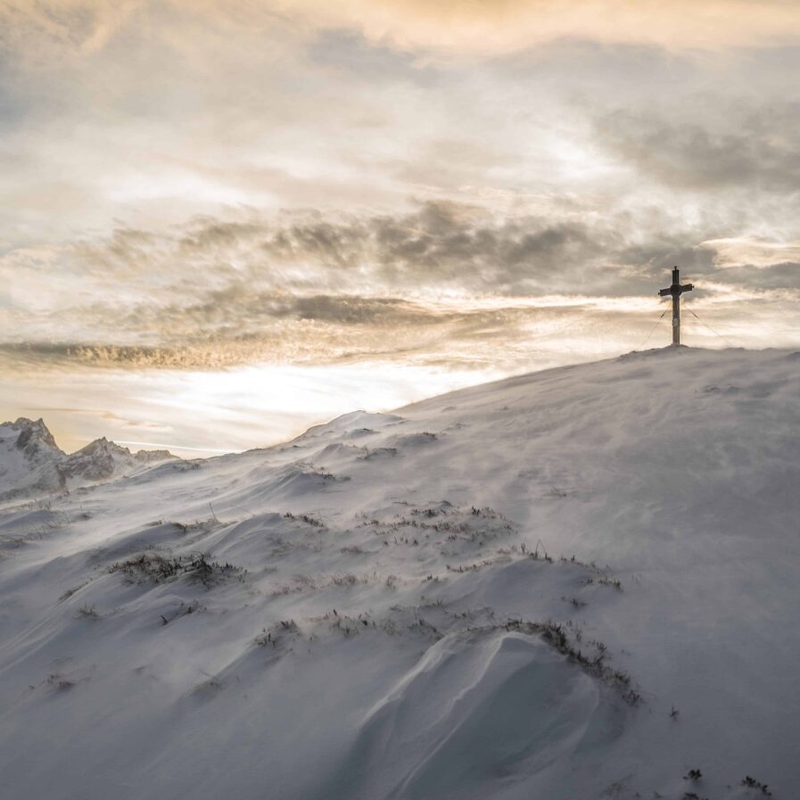 Monument on a snowy hilltop